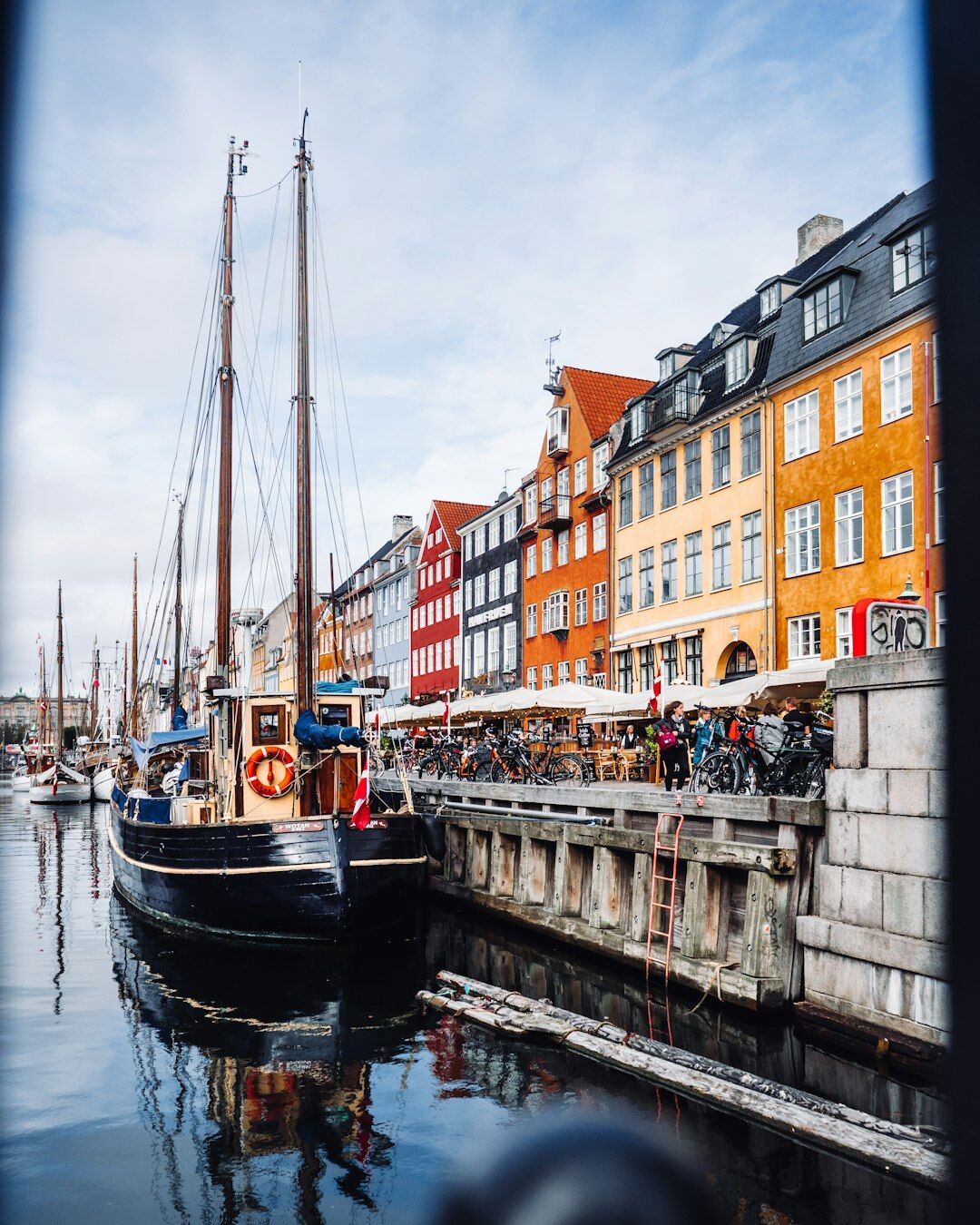 Danish fisherman mending nets on a harbor pier