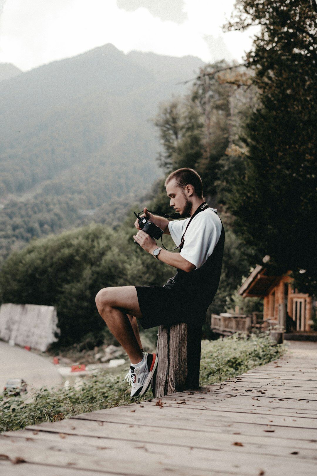 Photographer crouching to take a photo outdoors